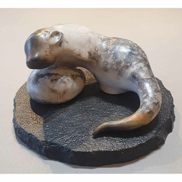 Alternative view of Smoke fired stoneware sculpture 'Large Otter' on a slate base, by Carol Pask