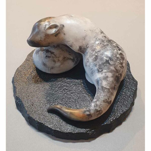 Alternative view of Smoke fired stoneware sculpture 'Large Otter' on a slate base, by Carol Pask