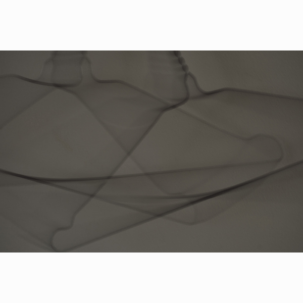 Photograph entitled 'the coathangers in mimi's hall' by Han Lee de Boer